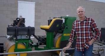 Plympton-Wyoming inventor Jason Cates stands next to his Rollinator. April 3, 2019. (Photo by Colin Gowdy, BlackburnNews)