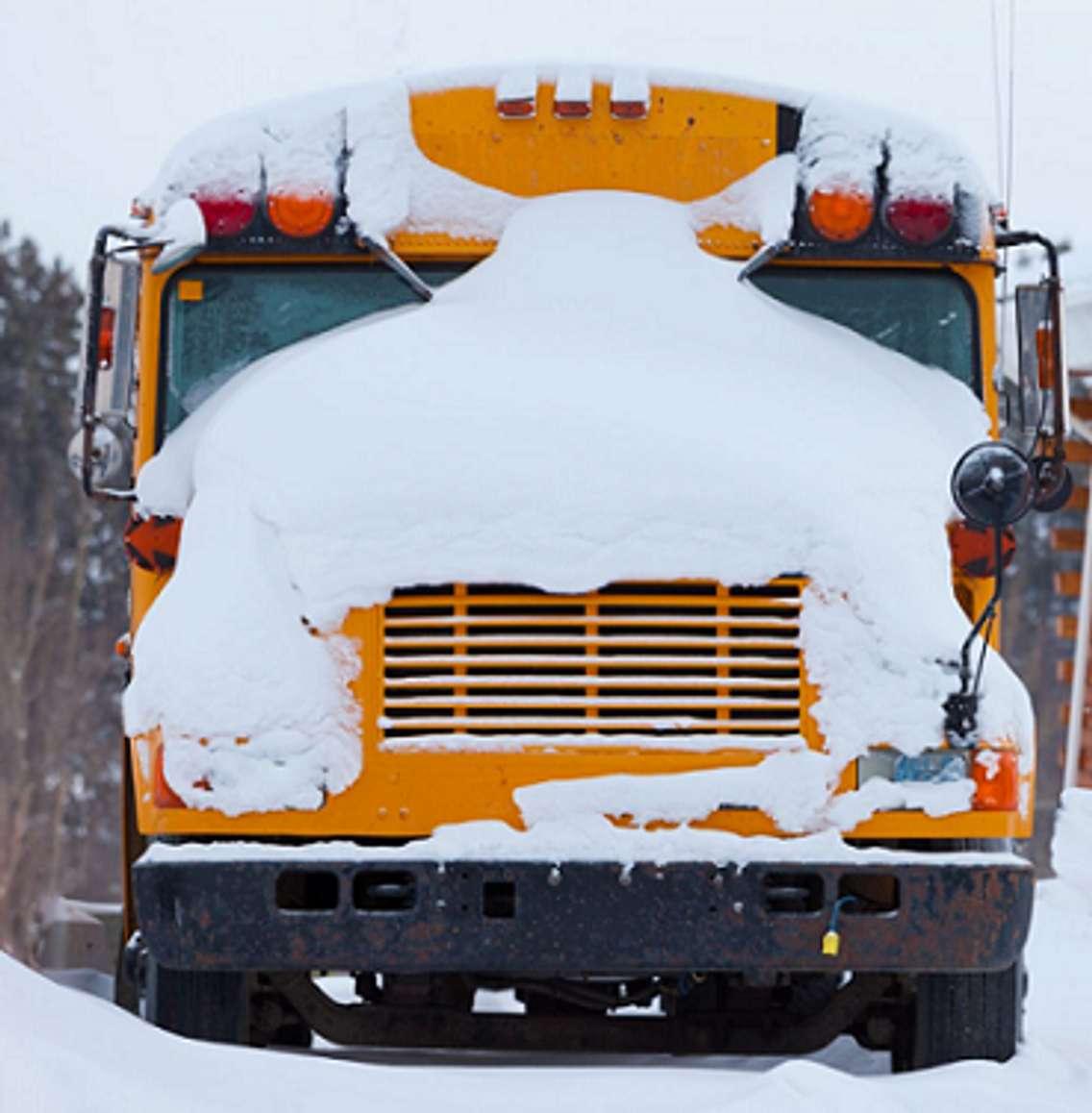 A school bus covered in snow. File photo courtesy of © Can Stock Photo / PiLens.