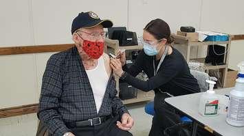 96-year-old John Percival receives his first dose of Pfizer vaccine from RPN Kristin Persichetti. Mar. 6, 2021 (BlackburnNews.com photo by Stephanie Chaves)