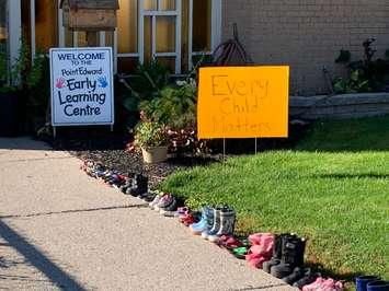 An "Every Child Matters" sign and children shoes line the entrance to the Point Edward Early Learning Centre. September 30, 2021 Submitted photo.