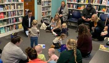 Lambton County Warden Kevin Marriott helps deliver storytime programming at a local library. Photo submitted by the County of Lambton.