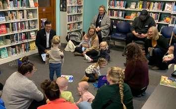 Lambton County Warden Kevin Marriott helps deliver storytime programming at a local library. Photo submitted by the County of Lambton.