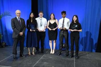 Awards presented to Anne McFadyen Scholarship recipients. From left to right: George McFadyen, Marissa Vu-Nguyen, Owen Roberts, Kyleigh Noels, Raihaan Abrahim, Maya Chaikam. June 12, 2025. (Photo courtesy of Great Lakes Secondary School)