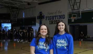 Grade 12 student Maggie Hamel and Grade 11 student Adalyn Dinell, members of the Irish Miracle organizing committee. December 3, 2024. (Photo by Natalia Vega)