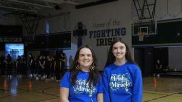 Grade 12 student Maggie Hamel and Grade 11 student Adalyn Dinell, members of the Irish Miracle organizing committee. December 3, 2024. (Photo by Natalia Vega)