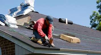 A roofer repairs a roof in Oklahoma. 22 June 2010. (Photo by Patsy Lynch from the FEMA Photo Library)