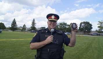 Sarnia Police Chief Derek Davis with PSD Vader's badge, August 9, 2024 (Photo by: Lindsay Newman/ Blackburn Media)