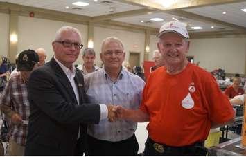 City of Sarnia Councillor Mike Kelch congratulates local blood donor Carl Hall for making his 150th blood donation. August 5, 2015 (BlackburnNews.com Photo by Briana Carnegie)