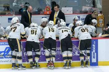 Sarnia Sting head coach Alan Letang speaks with his team during a timeout. Metcalfe Photography. 
