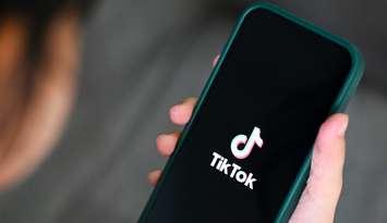 A person launches the TikTok app on their cellphone. File photo courtesy of © Can Stock Photo / Engdao