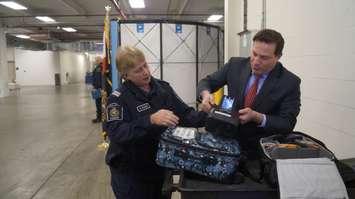 Superintendent Sally Craggs demonstrates to Minister Marco Mendicino the x-ray equipment used. January 17, 2023. (Photo by Natalia Vega)
