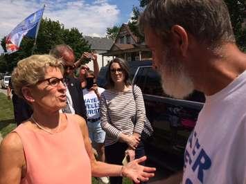 Kevin Jakubec meets the premier during her visit to Chatham. July 27, 2017. (Photo by Paul Pedro)