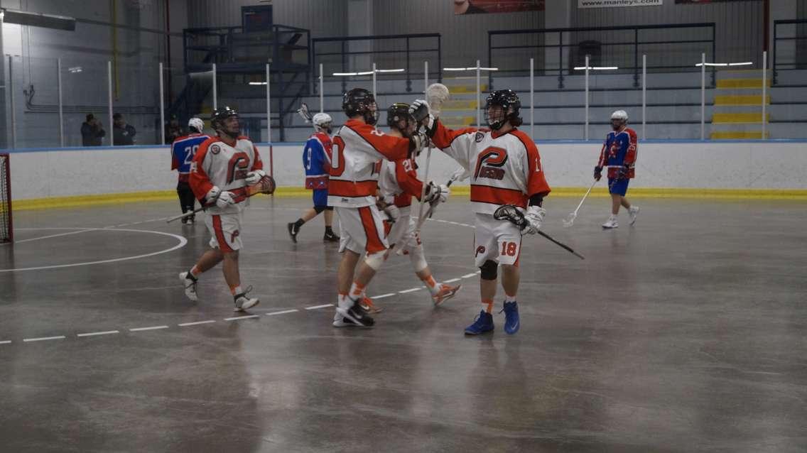 The Pacers celebrate a goal in a 19-9 victory over Welland (Photo by Jake Jeffrey