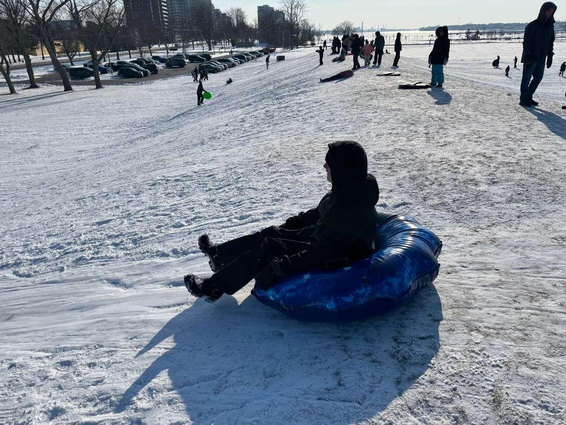 Kids sledding at Sarnia's Centennial Park. Photo by Melanie Irwin. 