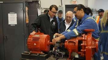 MPP Monte McNaughton and MPP Bob Bailey are given a demonstration at Millwright Local 1592 in Sarnia. June 15, 2023. (Photo by Natalia Vega) 