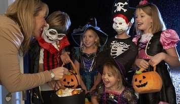 Kids trick-or-treating on Halloween. File photo courtesy of © Can Stock Photo / monkeybusiness