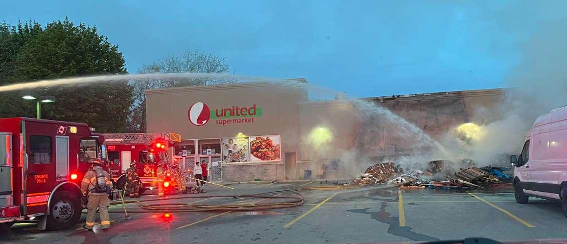 Firefighters battle a fire at United Supermarket at 1062 Adelaide Street North, May 12, 2023. Photo courtesy of the London Fire Department.