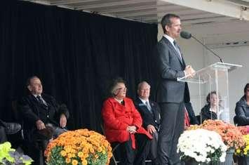 Chris Hadfield stands in Sarnia's Rotary showmobile at a ceremony unveiling interpretive signs at the airport that bear his name. Oct. 5, 2014 (BlackburnNews.com photo by Dave Dentinger)