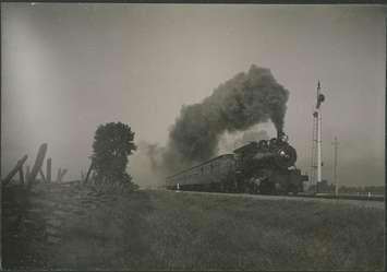 Ill-fated engine and train of the Wanstead Disaster. Photo from the British Library by James Sinclair Crawford from wikipedia.