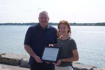 Gracie Hobbs is awarded with the Tony Stranak Conservation Scholarship by St. Clair Region Conservation Foundation, Executive Director, Ken Phillips. (Photo by: SCRCA)