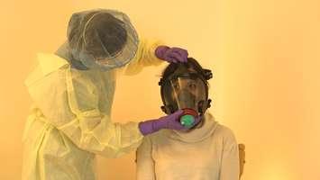 A non-invasive ventilation mask being setup on a patient. Photo courtesy of Lawson Health Research Institute.