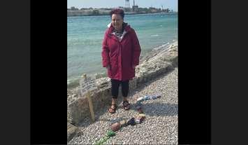 Wendy Marsden stands with the beginning of 'Rocky' the rock snake in Point Edward. June, 2023 Submitted photo.