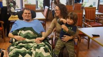 Les Shortt, Jessica McDowell and their son Jaxon hold the keys to their new Habitat for Humanity home. March 23, 2016 (photo by Jake Jeffrey)