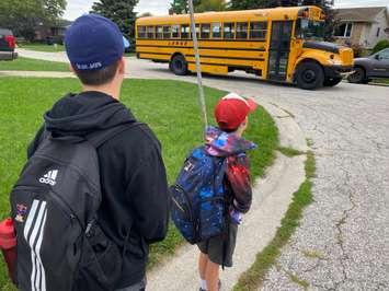 Students get on school bus. September 2022. (Blackburn Media file photo)