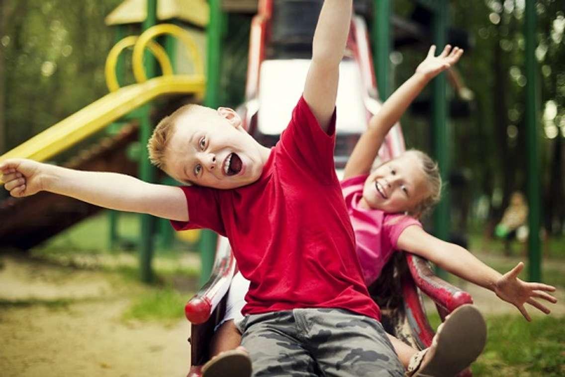 Children playing on the playground. File photo courtesy of © Can Stock Photo / gpointstudio