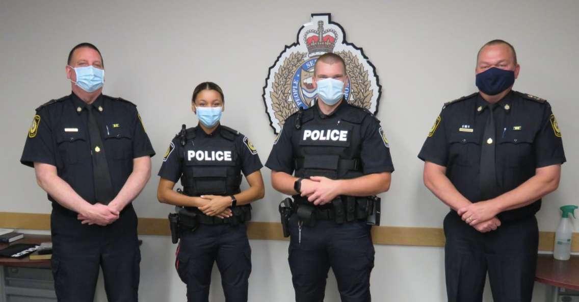 (From left to right) Sarnia Police Deputy Chief Owen Lockhart, Cst. Keana Knight, Cst. Benjamin Lane, and Chief Norm Hansen pose for a photo during a swearing-in ceremony. May 2021. (Photo by Sarnia Police Service)