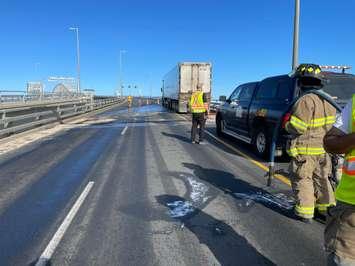 Point Edward Fire and Rescue Services help clean a diesel spill on the Blue Water bridge (Photo by: Point Edward Fire and Rescue)