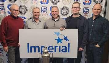 L to R - Dale Kelly (skip), Don Bourque, Gary Pitre, and Brian Scott of the Sarnia Golf & Curling Club. Also pictured is Ian Parker, representative from Imperial Oil (Photo courtesy of SGCC)