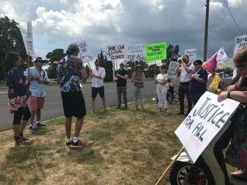 A group of people protesting provincial cuts to legal aid gathered outside Sarnia-Lambton MPP Bob Bailey's office in Sarnia. July 30, 2019 Photo by Melanie Irwin 