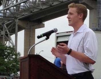 Daniel Marr accepts the Maynard and Rene Walker Family Scholarship at the village's Canada Day celebration. (Photo courtesy of Village of Point Edward) 
 
