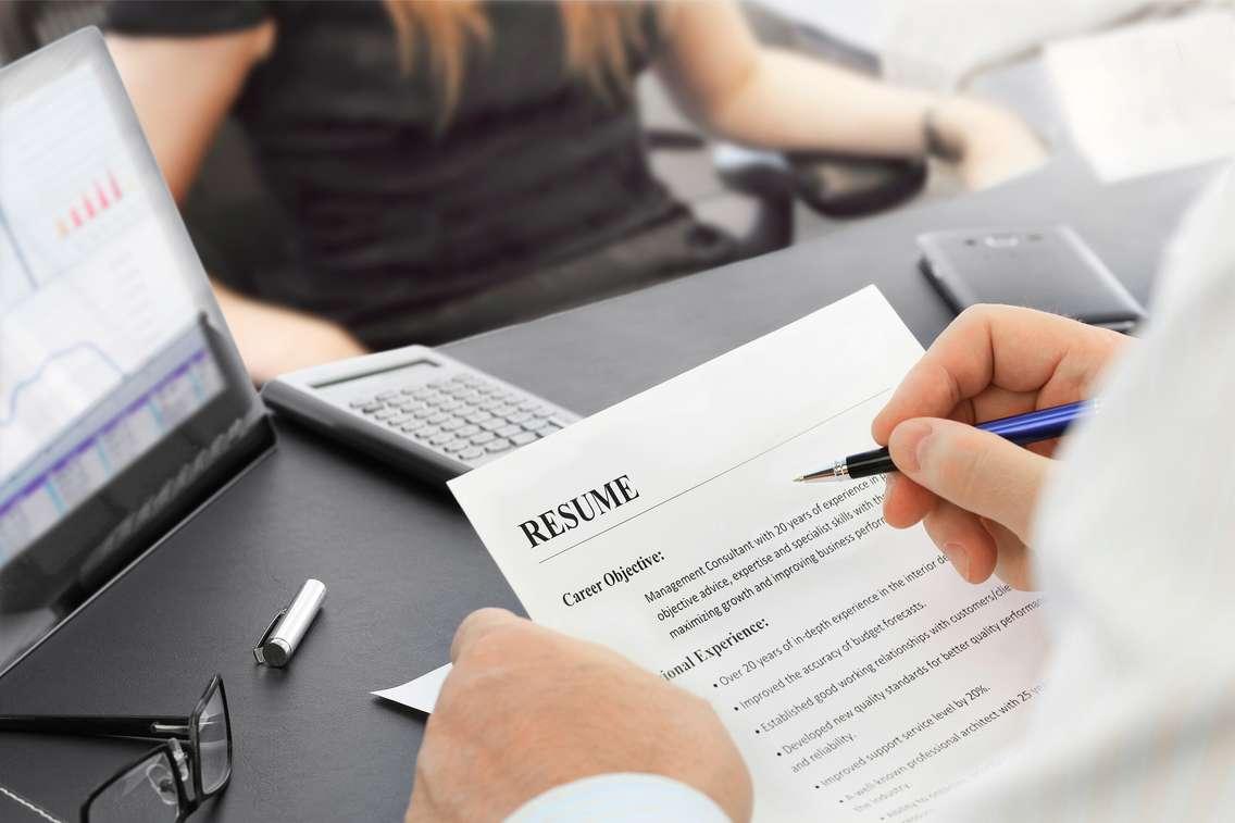 Job interview in the office with focus on resume and pen.  © Can Stock Photo / nan104