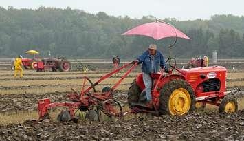 Tractor plowing through field. (Photo courtesy www.plowingmatch.org)