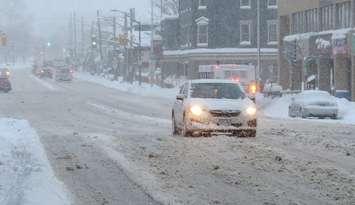 A vehicle navigates snowy conditions on Richmond Street in London. (File photo by Miranda Chant, Blackburn Media)