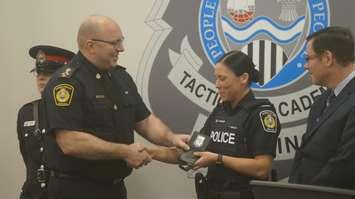 Sarnia Police Chief Derek Davis congratulates Sarnia Cst. Danielle Johnson during a swearing-in ceremony at the Sarnia Police Tactical and Academic Training Centre. 6 April 2023. (Photo by SarniaNewsToday.ca)