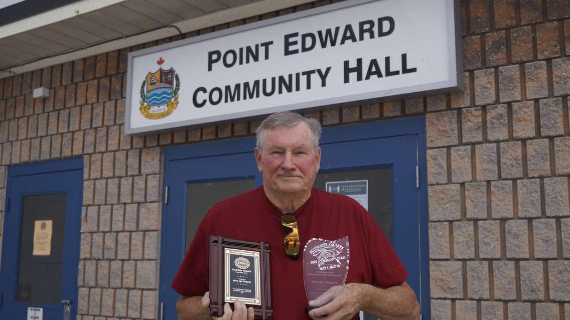 Jake van Rooyen of Bluewater Anglers Hatchery, displays his awards for dedication to the hatchery and conservation. 29 September 2020. (BlackburnNews.com photo by Colin Gowdy)