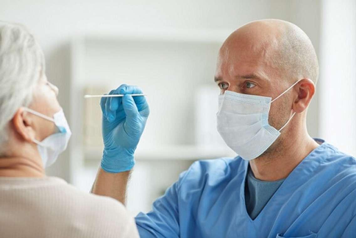 A doctor  performs a nasal swab test for COVID-19. File photo courtesy of © Can Stock Photo / SeventyFour