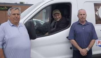 Sarnia Blessings Kevin Allen and Co-owners of Progressive Auto Sales Dan and John Whitton on July 17, 2025 (Photo by: Lindsay Newman/ Blackburn Media)