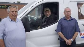 Sarnia Blessings Kevin Allen and Co-owners of Progressive Auto Sales Dan and John Whitton on July 17, 2025 (Photo by: Lindsay Newman/ Blackburn Media)