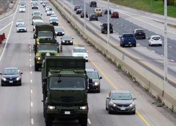 Military vehicles travelling on highway. (File photo courtesy of DND/CAF 2024)