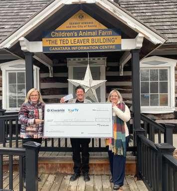 Lambton Circles Coordinator Kim Godin, Lambton Circles Coach Martine Creasor, and Seaway Kiwanis club member Cheri Roberts with a donation of $4,000.  December 2021.  (Photo by Seaway Kiwanis). 