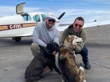 Pilots4Paws pilots Jeremy Hall and Dave Vallillee with Buddy and Griff. April 2023. (Photo by Sarnia Humane Society).