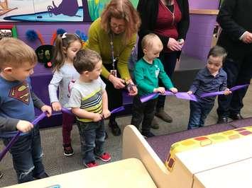 Pathways Executive Director Jenny Greensmith helps children cut the ribbon opening a new Smilezone at the centre. February 4, 2019 Photo by Melanie Irwin