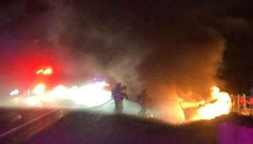 Firefighters extinguish a vehicle fire on Highway 401 between Currie and Iona roads. Photo courtesy of the Dutton/Dunwich Fire Department on X