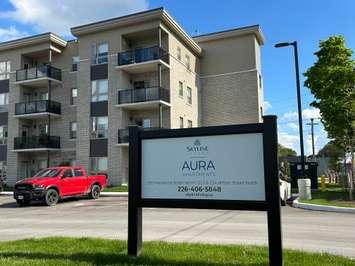 Aura Apartments sign. May, 2025. Blackburn Media Inc. photo by Lindsay Newman.