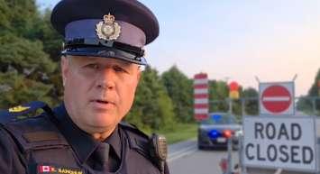 OPP Sergeant Ed Sanchuk provides an update on a crash on Pioneer Line. July 14, 2025. (Screenshot of video update via @OPP_WR on X)