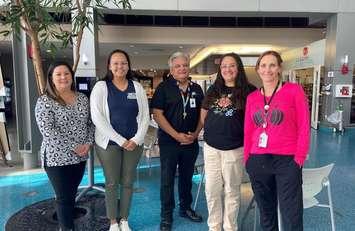 Aamjiwnaang First Nation Community Wellness Worker Roberta Bressette, Erie St. Clair Regional Cancer Program Indigenous Project Coordinator & Patient Education Coordinator Shannon White, Bluewater Health Indigenous Navigation Coordinator Doug George, Bluewater Health Indigenous Substance Use Care Partner Ashley Stone, and Sarnia-Lambton OHT Interim Executive Lead Nadine Neve. October 2023 (Photo couresy of Sarnia-Lambton OHT)